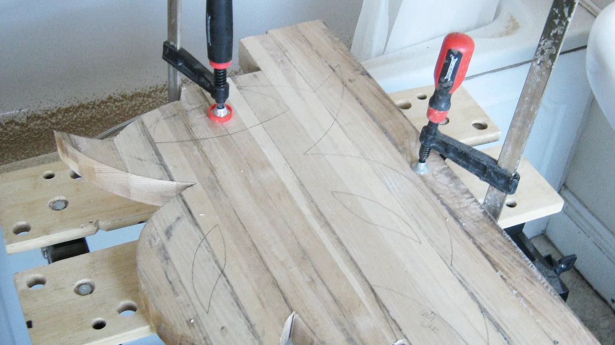 Wood clamped to a portable workbench for a DIY project.