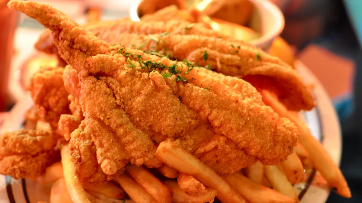 A casual seafood platter with shrimp and fried fish